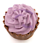 Blood orange butter ganache in a dark chocolate cup, topped with a piece of orange jelly